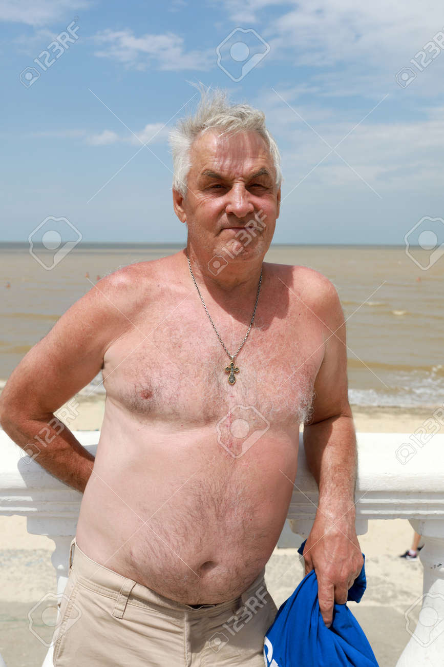 files/105678376-senior-man-posing-on-the-beach-in-summer.jpg